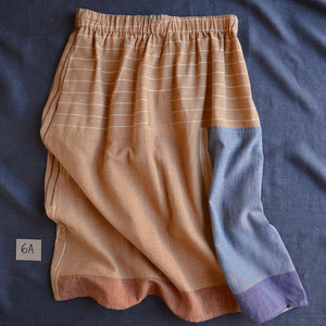 Skirt with a patchwork design on a blue fabric background