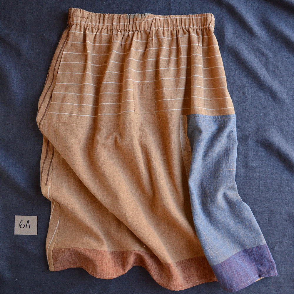 Skirt with a patchwork design on a blue fabric background