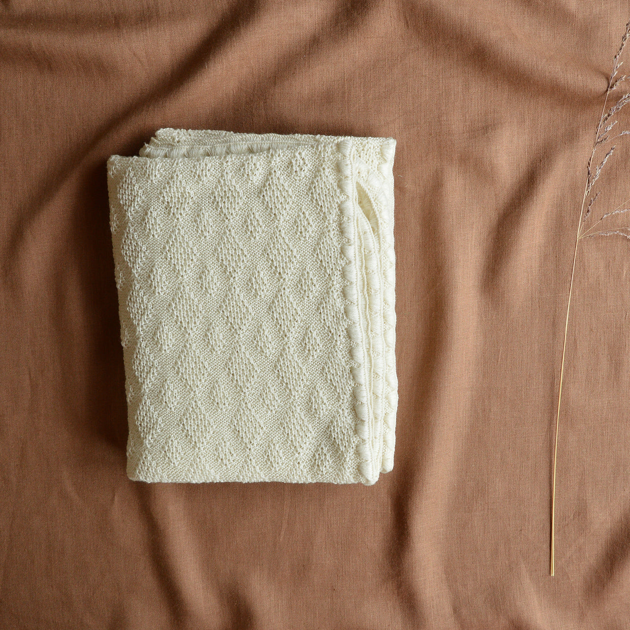 classic knitted wool baby blanket from Disana available with Woollykins