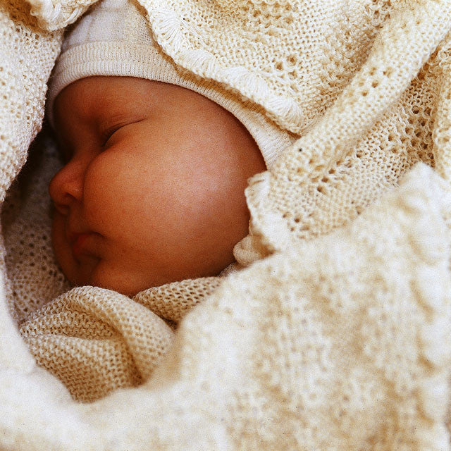 classic knitted wool baby blanket from Disana available with Woollykins